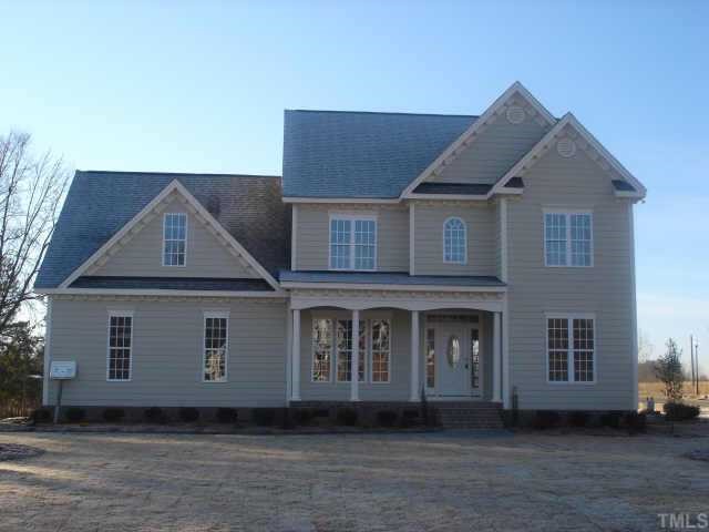 1016 Grissom Farm Road Garner, NC 27529 - Photo 1 of 1 a front view of a house with a yard
