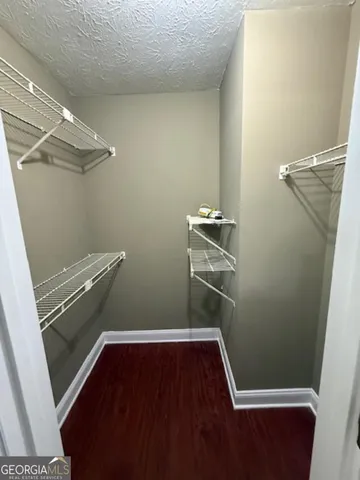 a white toilet sitting next to a shower