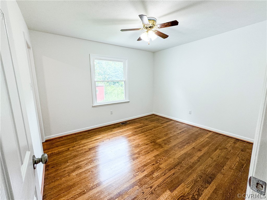 1787 Mc Cune Road Crewe, VA 23930 - Photo 15 of 41 a view of empty room with wooden floor
