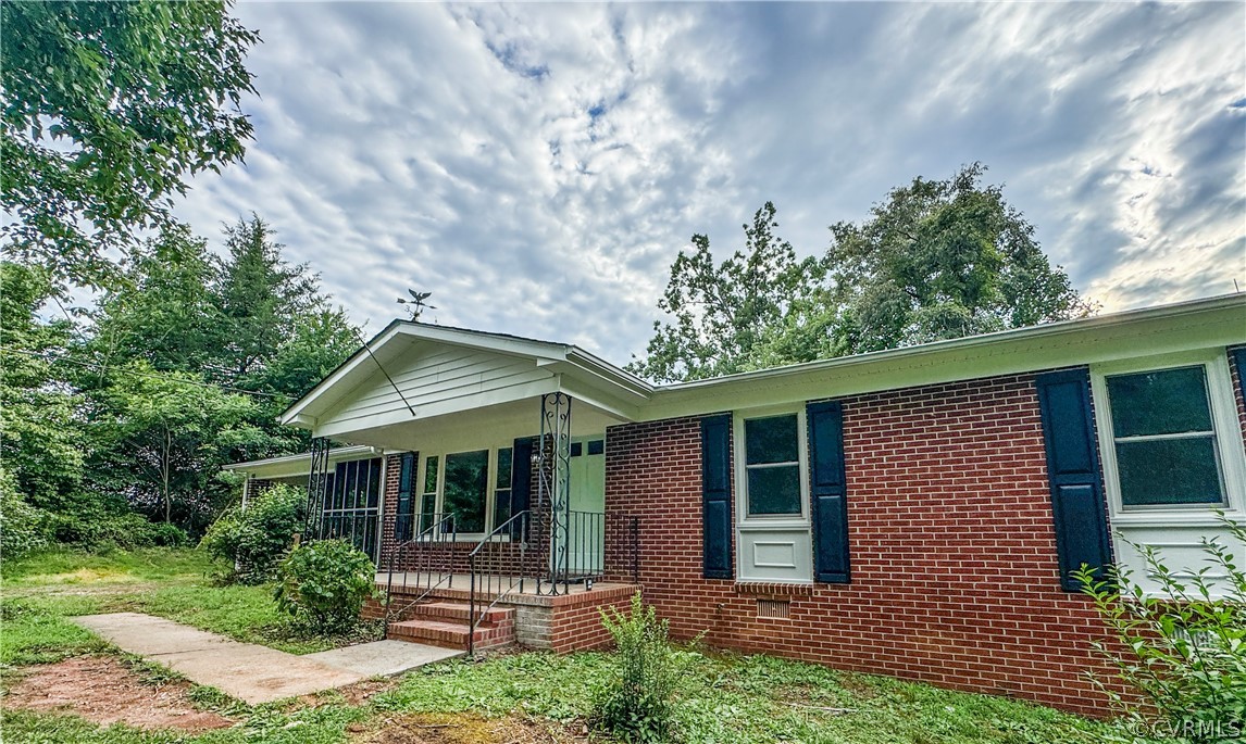1787 Mc Cune Road Crewe, VA 23930 - Photo 2 of 41 a front view of a house with garden
