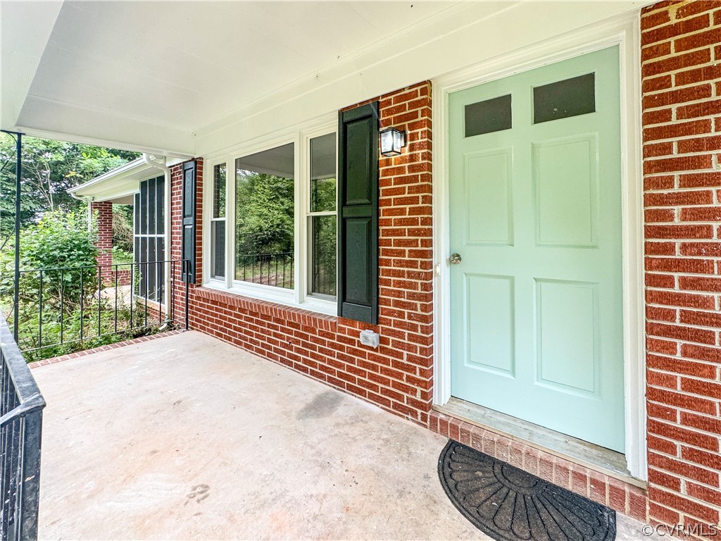 1787 Mc Cune Road Crewe, VA 23930 - Photo 4 of 41 a view of porch with a door and wooden floor