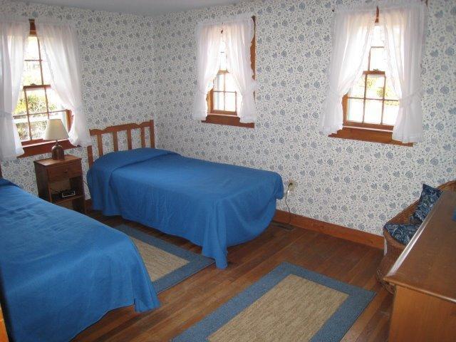 49 Captain Chase Road Dennis Port, MA 02639 - Photo 6 of 18 a bedroom with two beds and a dresser