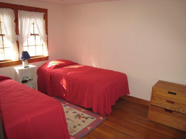 49 Captain Chase Road Dennis Port, MA 02639 - Photo 8 of 18 a bedroom with two beds and a window