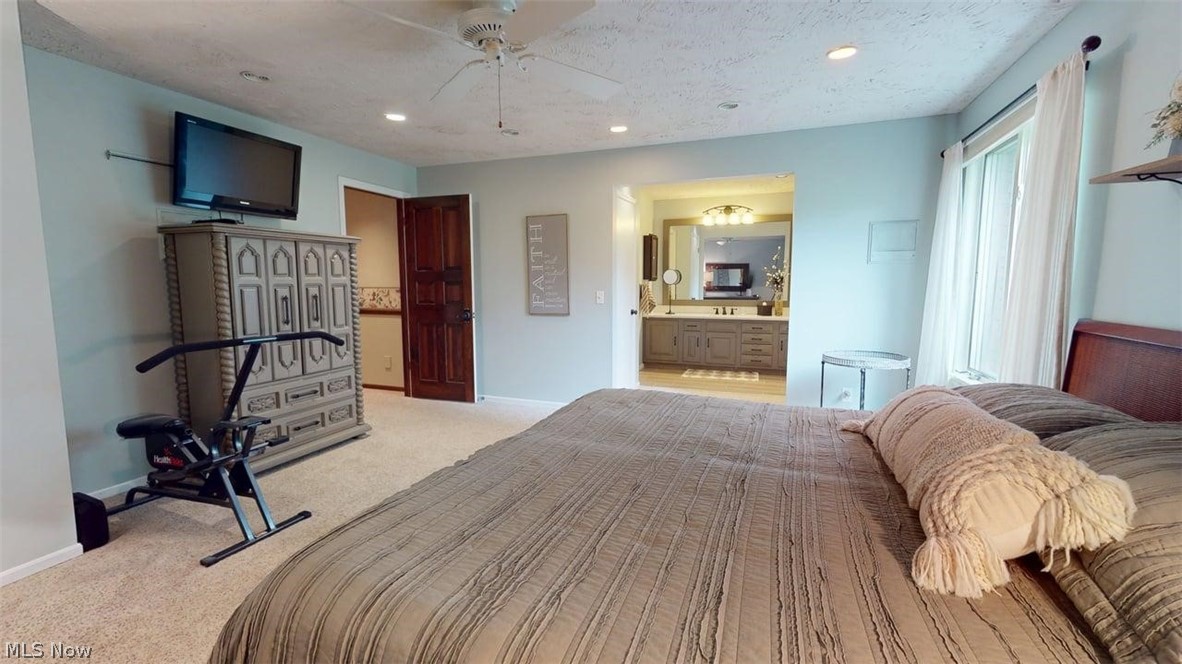 3985 Wiers Road Willard, OH 44890 - Photo 24 of 50 Carpeted bedroom featuring light blue walls and a ceiling fan