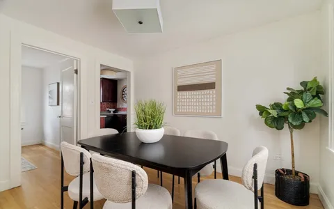 a kitchen with a sink and a stove top oven
