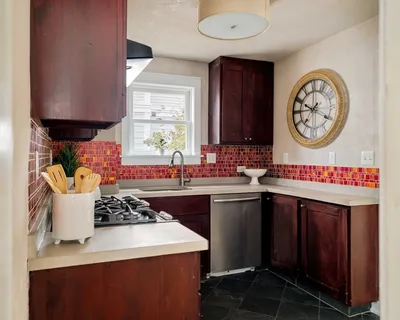 a kitchen with a stove and a sink