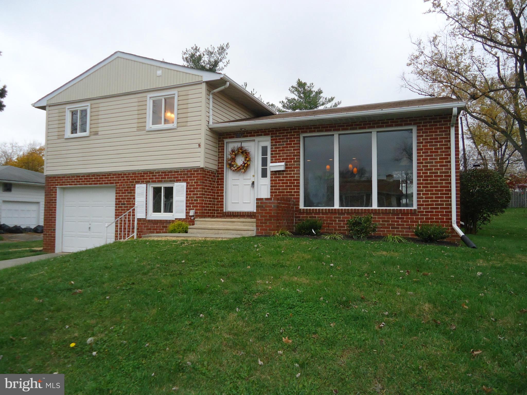 3614 Bellmore Road Baltimore, MD 21244 - Photo 2 of 20 front view of a house with a yard