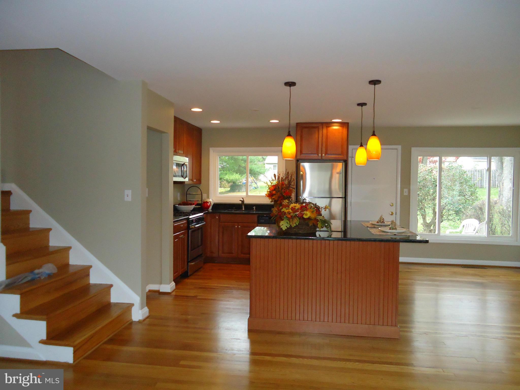 3614 Bellmore Road Baltimore, MD 21244 - Photo 3 of 20 a view of a living room and kitchen with a large window