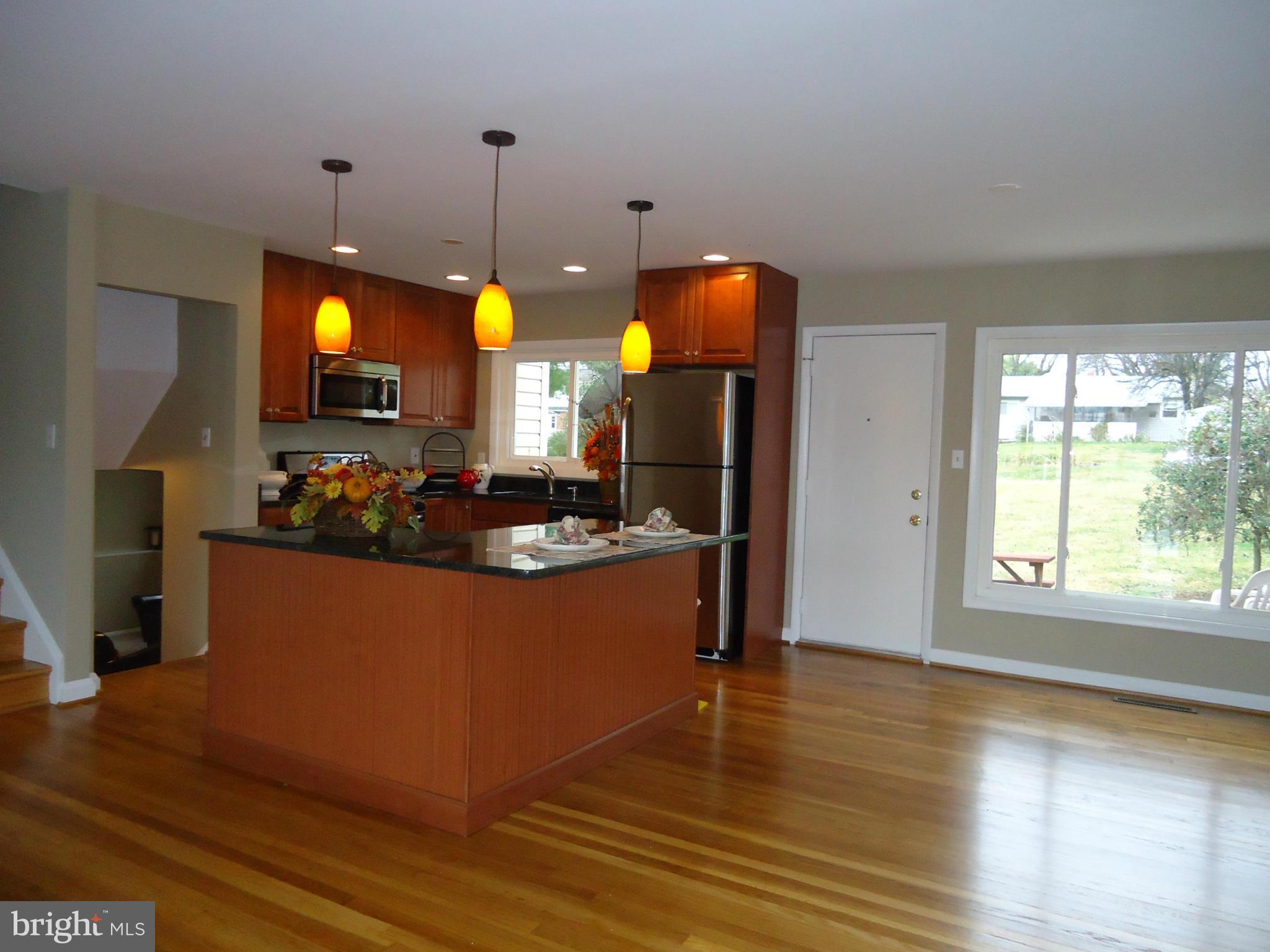 3614 Bellmore Road Baltimore, MD 21244 - Photo 7 of 20 a living room with furniture and a wooden floor