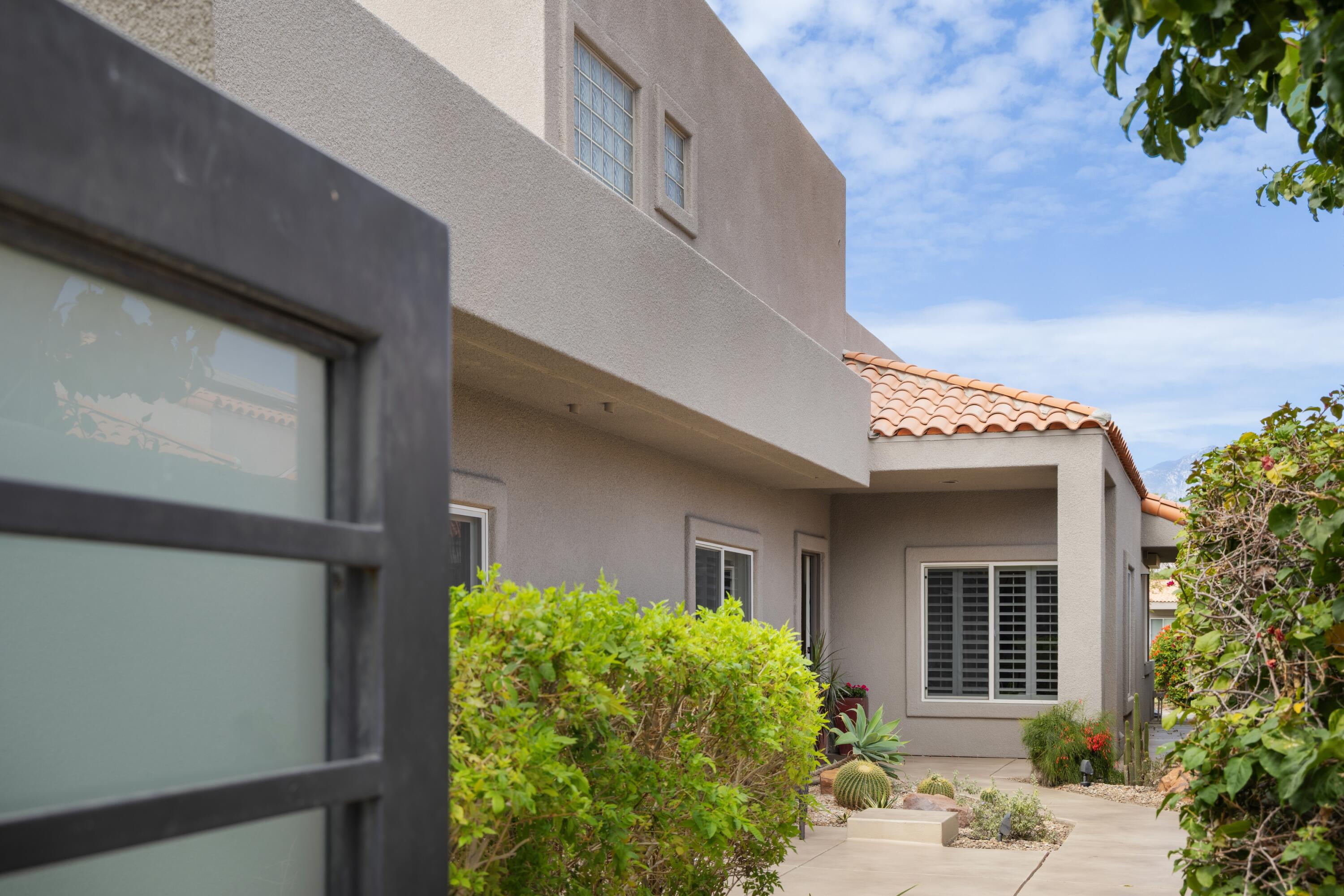 39 Augusta Drive Rancho Mirage, CA 92270 - Photo 5 of 53 a view of a house with potted plants