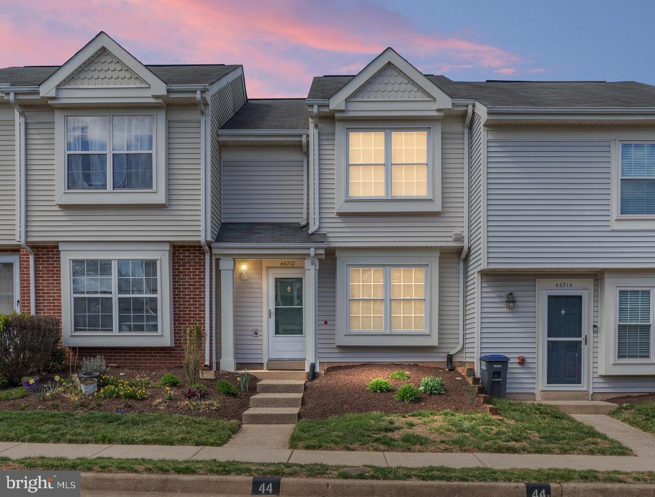 46712 Fielding Terrace Sterling, VA 20164 - Photo 1 of 22 a front view of a house with garden