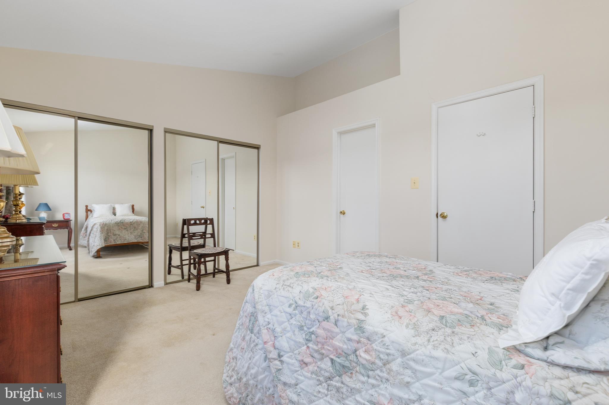 46712 Fielding Terrace Sterling, VA 20164 - Photo 14 of 22 a bedroom with a bed table and chairs