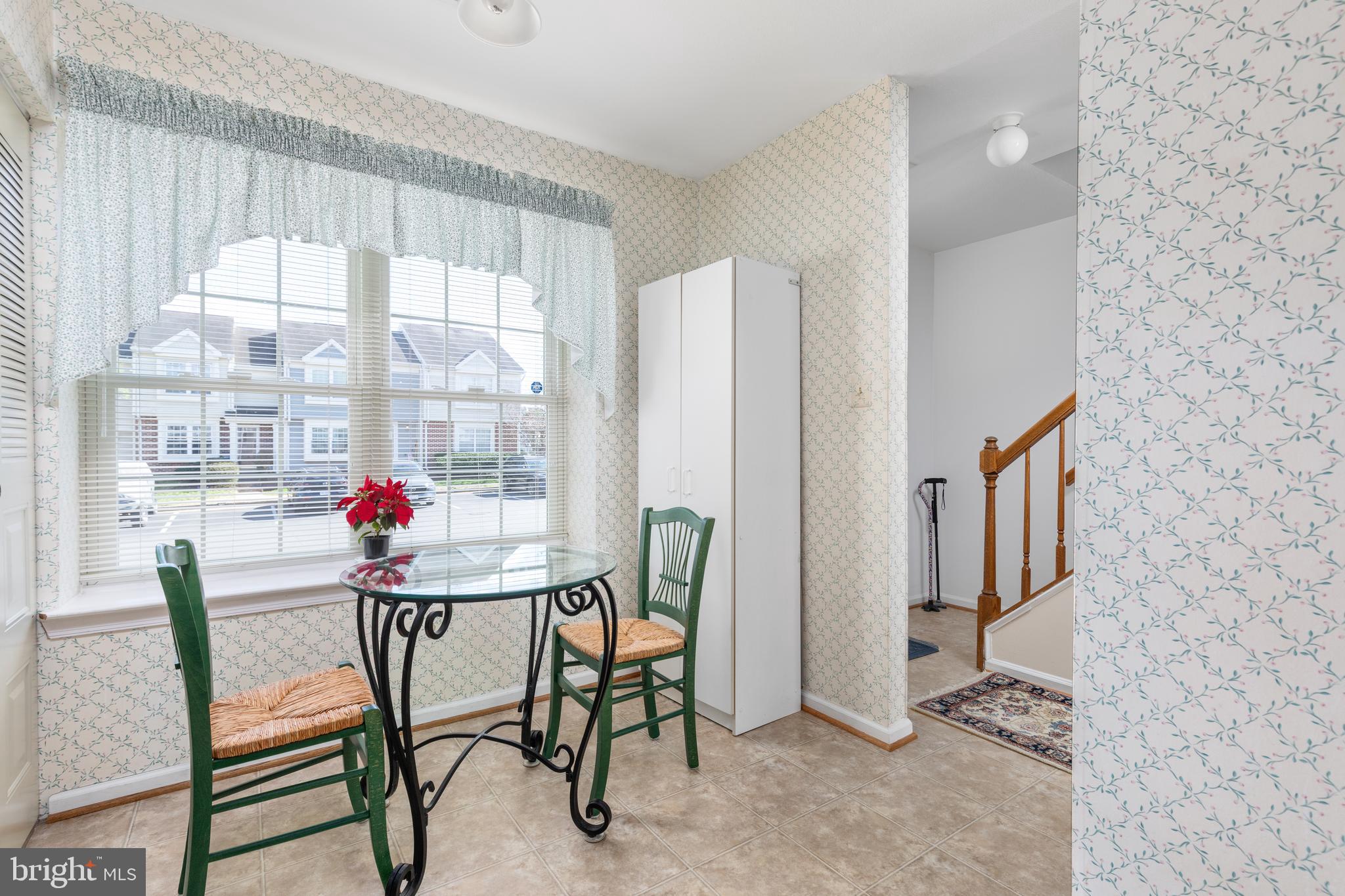 46712 Fielding Terrace Sterling, VA 20164 - Photo 4 of 22 a view of a dining room with furniture a chandelier and a window