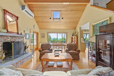 a living room with furniture or wooden floor and a chandelier