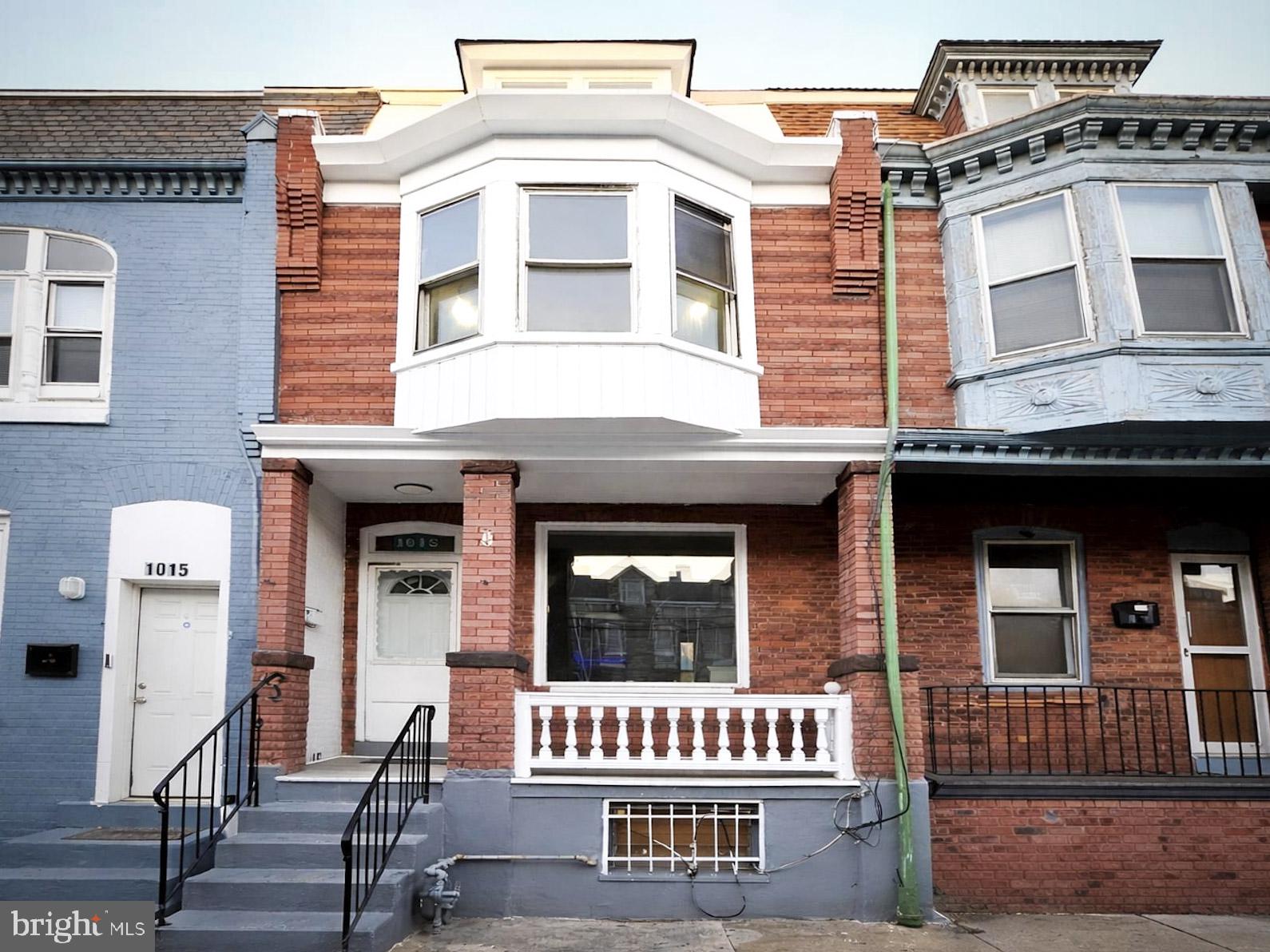 a front view of residential houses with stairs