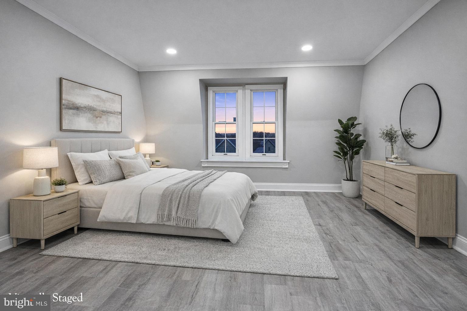 1013 North 10th Street Reading, PA 19604 - Photo 11 of 27 a spacious bedroom with a large bed and windows
