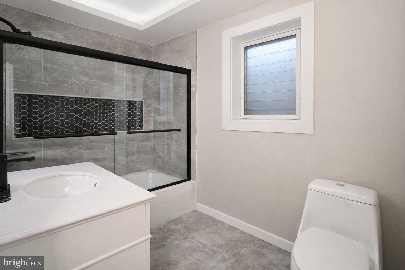 1013 North 10th Street Reading, PA 19604 - Photo 15 of 27 a bathroom with a sink and a mirror