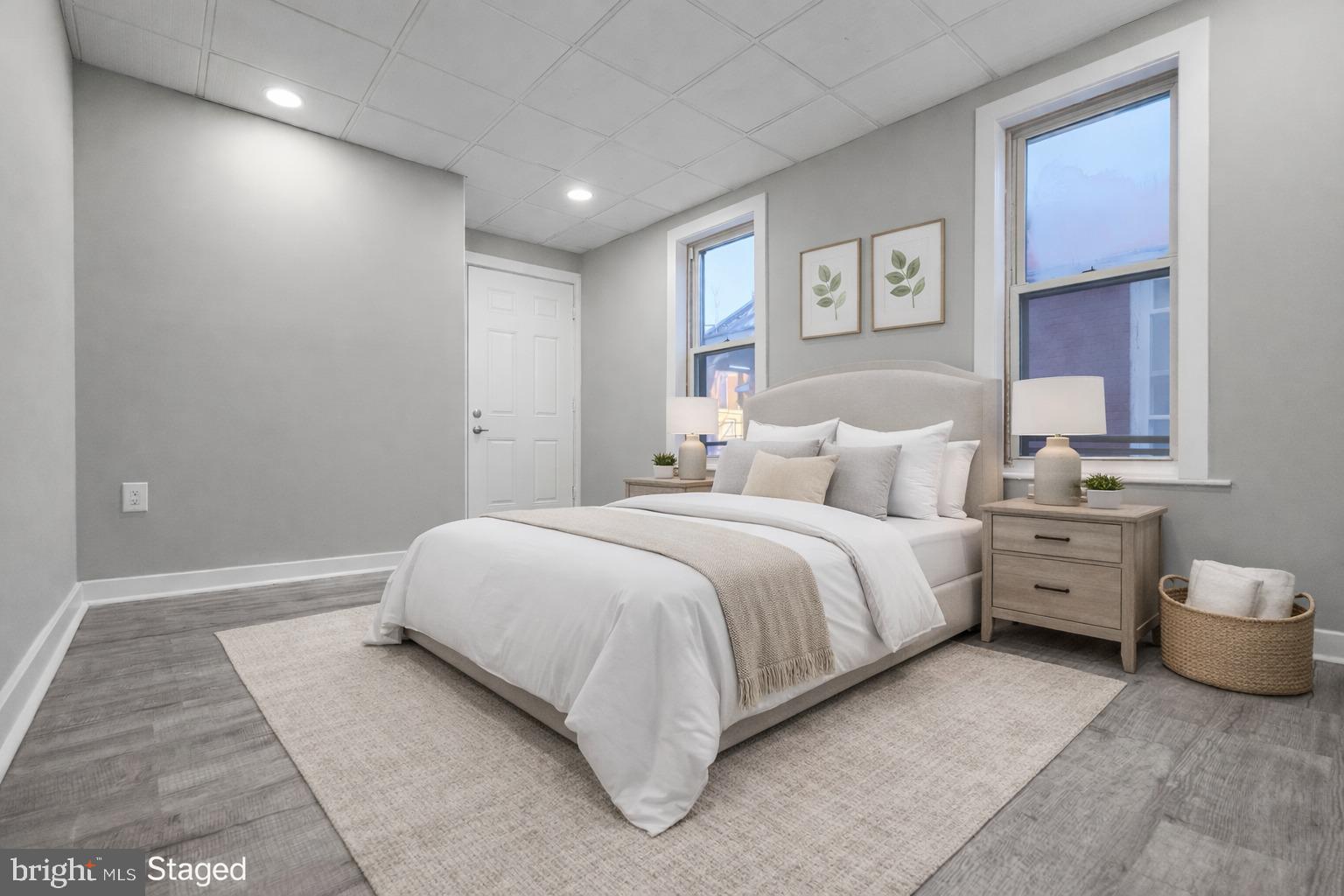 1013 North 10th Street Reading, PA 19604 - Photo 20 of 27 a spacious bedroom with a bed and a table