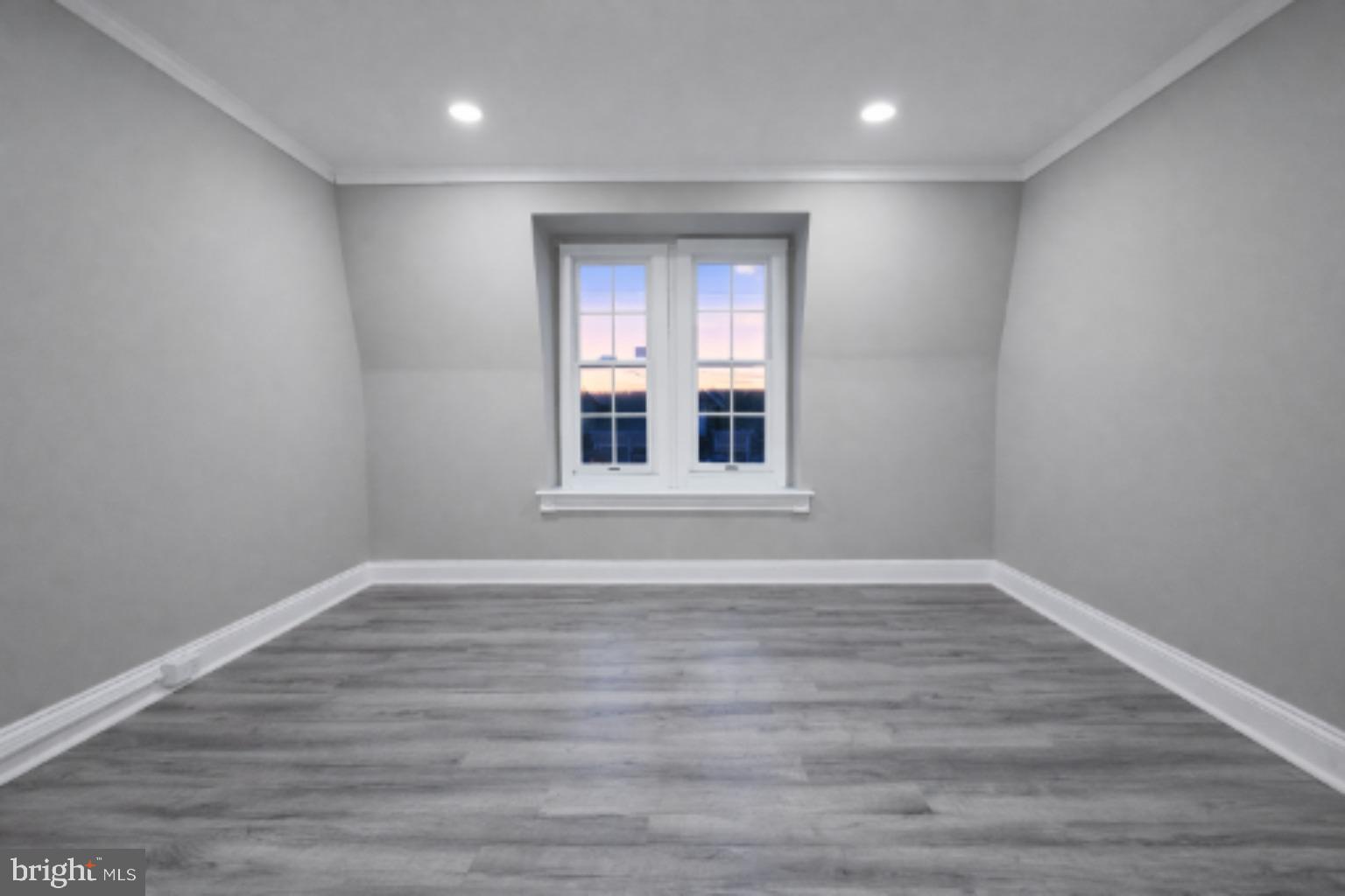 1013 North 10th Street Reading, PA 19604 - Photo 10 of 27 a view of an empty room with wooden floor and a window