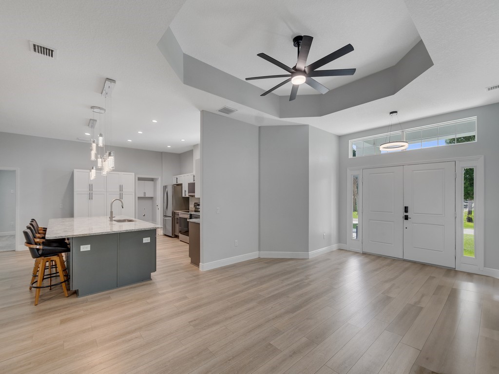 431 Midvale Terrace Sebastian, FL 32958 - Photo 10 of 34 a view of a kitchen with wooden floor and a window