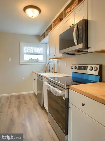 a kitchen with a stove and a microwave