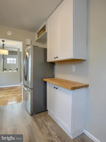 a view of cabinets and wooden floor