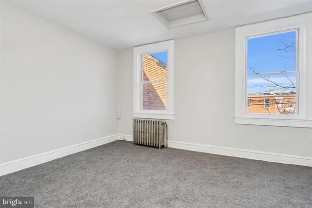 a view of an empty room and window