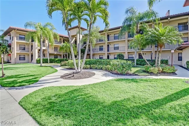 a view of a building with a yard