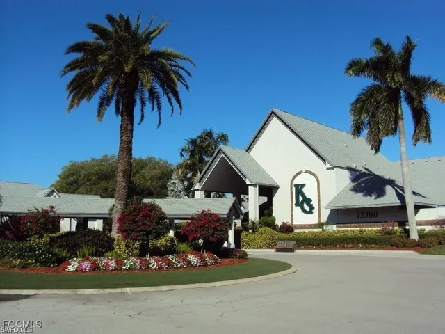 a front view of house with yard and trees