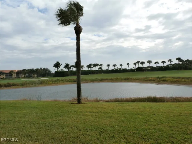 a view of a lake with a big yard