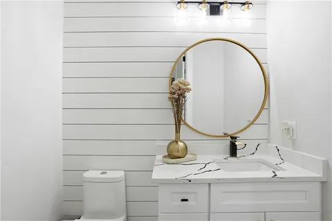 a bedroom with a bed lamp and window