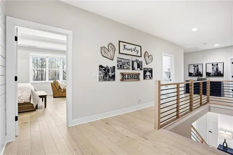 a bedroom with a bed a television and a large window