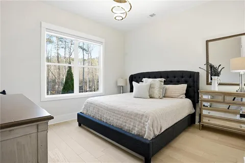 a bedroom with a bed and window