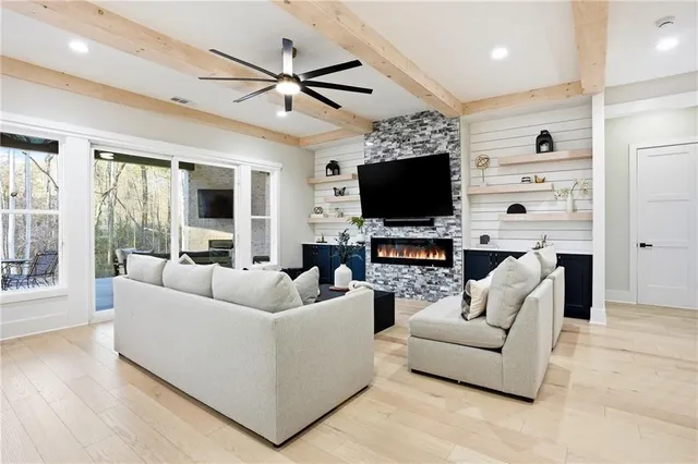 a living room with furniture and a flat screen tv