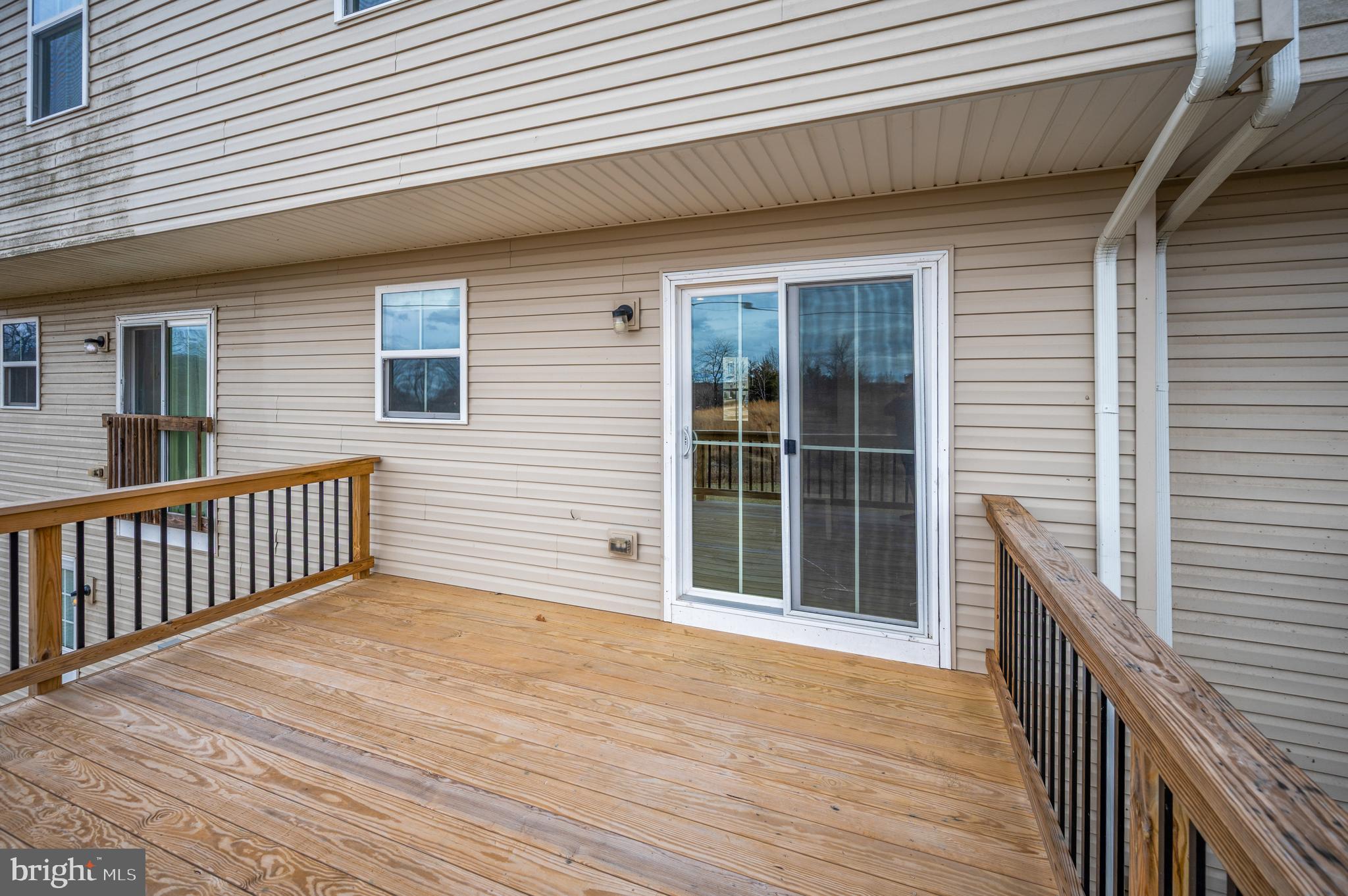 35252 Sara Court Locust Grove, VA 22508 - Photo 13 of 40 a view of backyard with deck and wooden floor