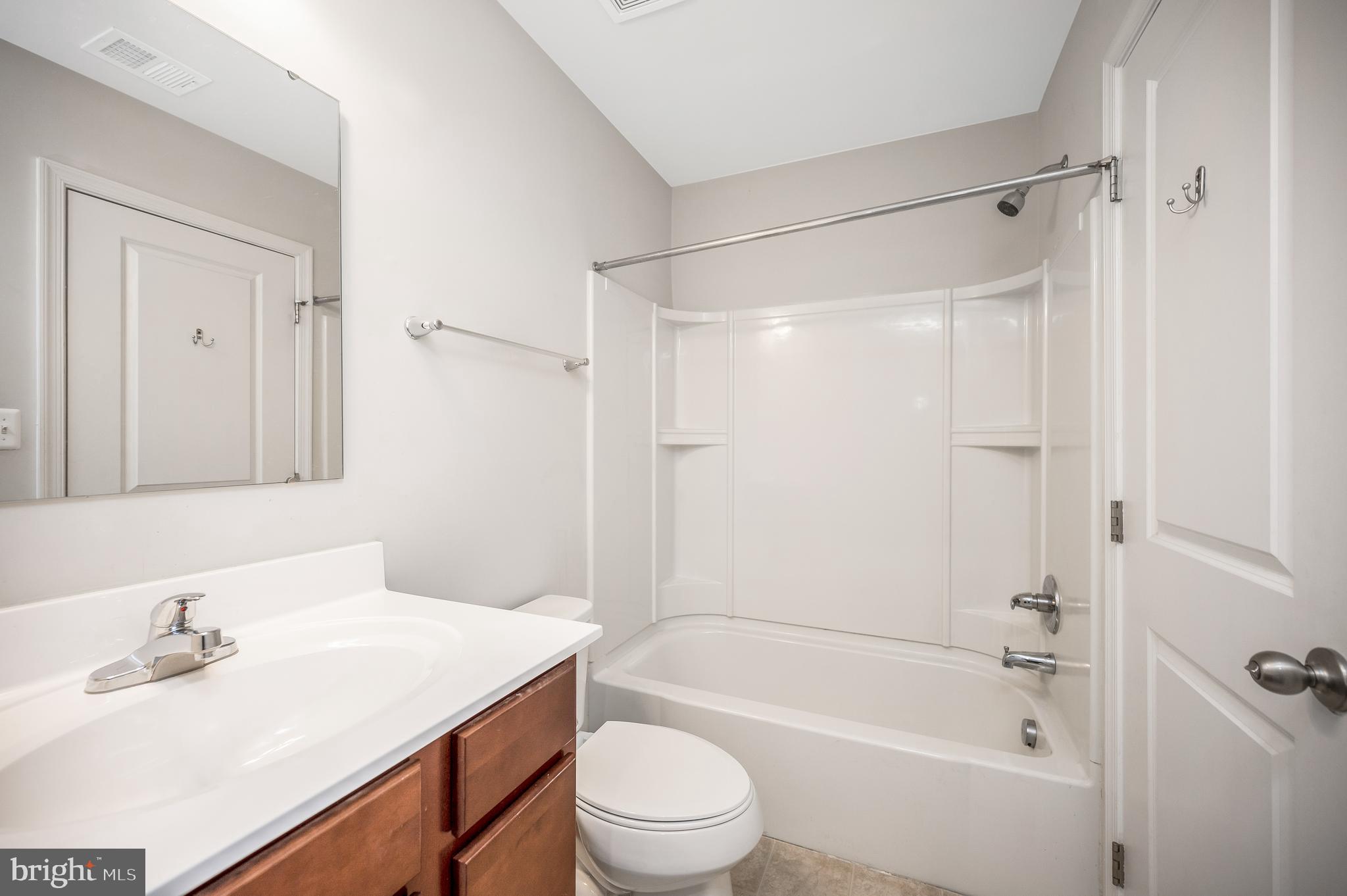 35252 Sara Court Locust Grove, VA 22508 - Photo 23 of 40 a bathroom with a sink a toilet and shower