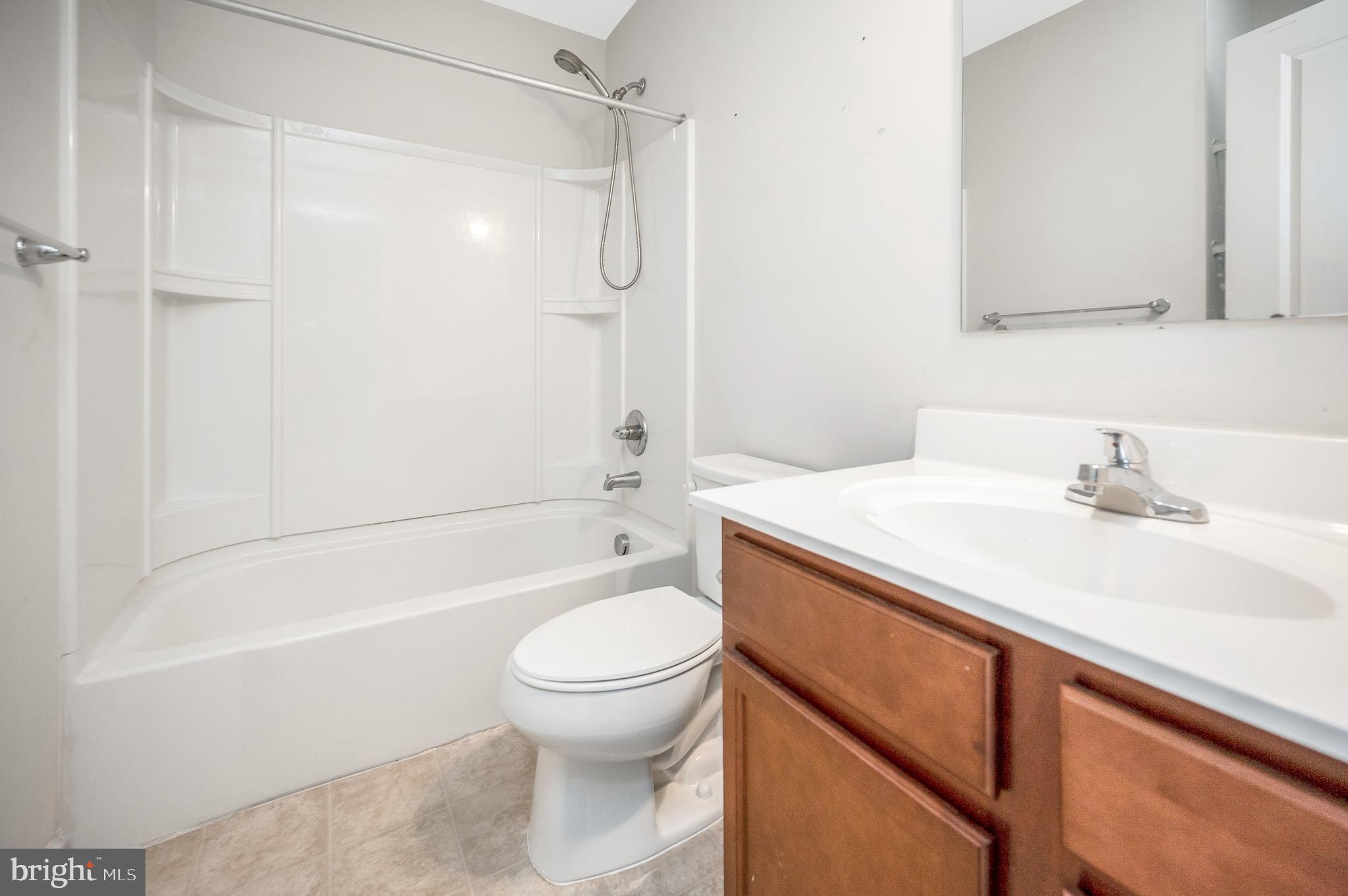 35252 Sara Court Locust Grove, VA 22508 - Photo 25 of 40 a bathroom with a sink a toilet and shower