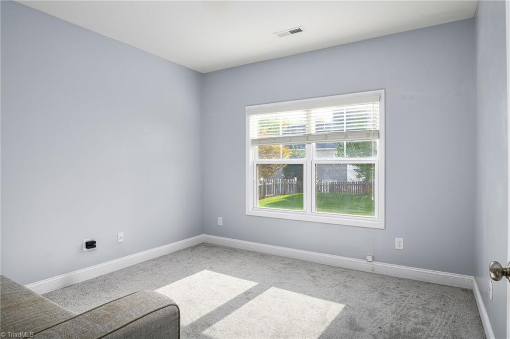 991 Beesons Field Drive Kernersville, NC 27284 - Photo 12 of 36 Main level sitting room, flex room, located at the back of the home, can be used as a music room, guest space - really whatever your heart desires!