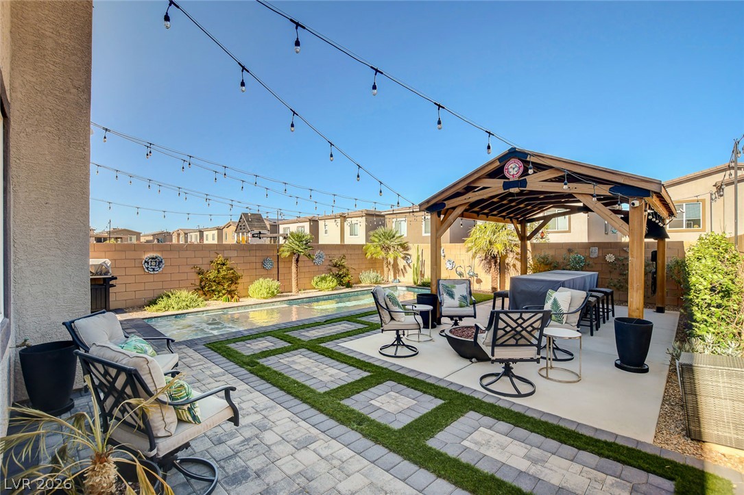 9688 Rankin Rdg Court Las Vegas, NV 89178 - Photo 47 of 53 An inviting backyard oasis offers a sparkling pool and a covered patio area for outdoor entertaining.