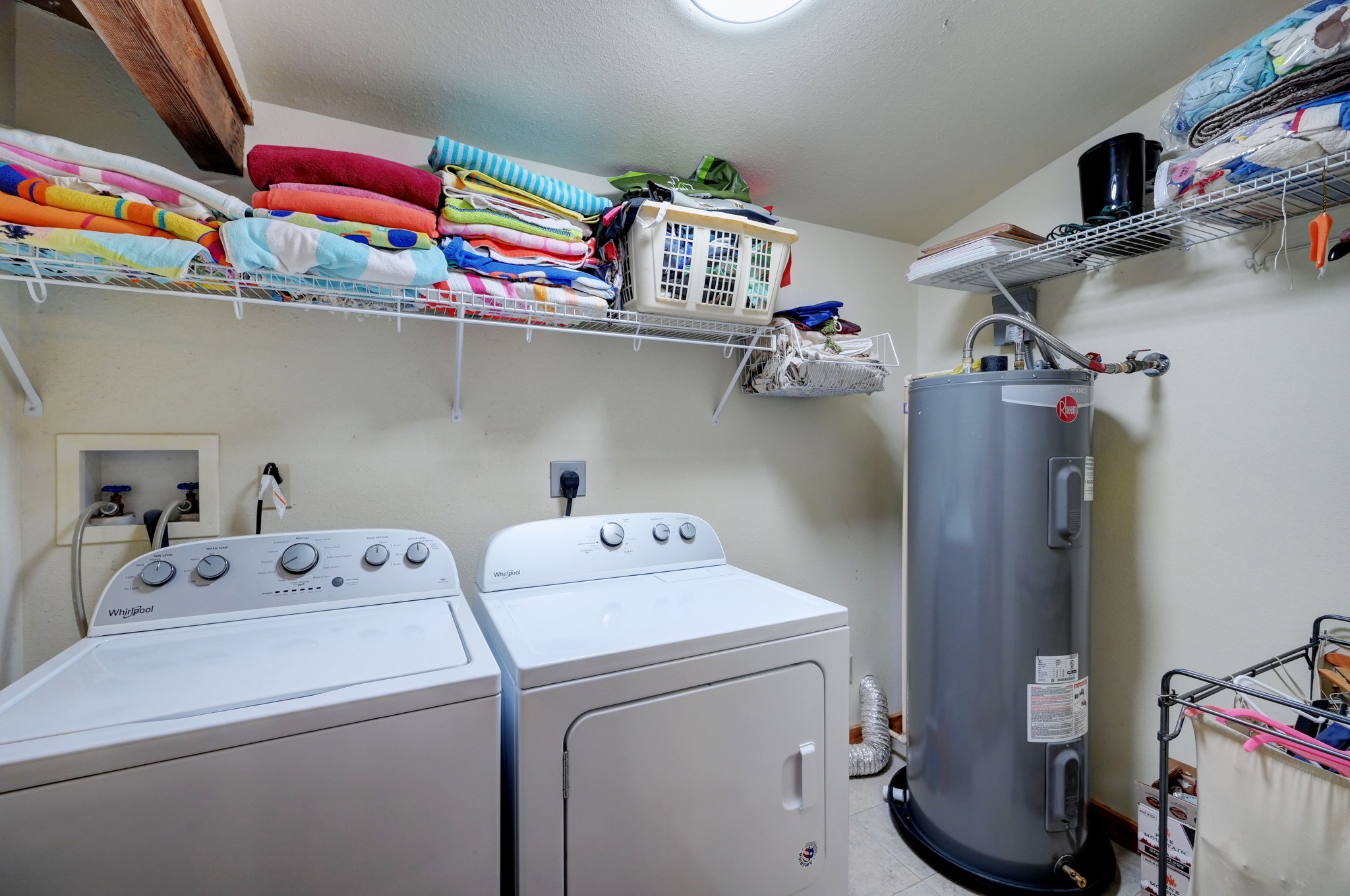 900 Box Canyon Road Wimberley, TX 78676 - Photo 32 of 40 Laundry room with water heater and washing machine and clothes dryer