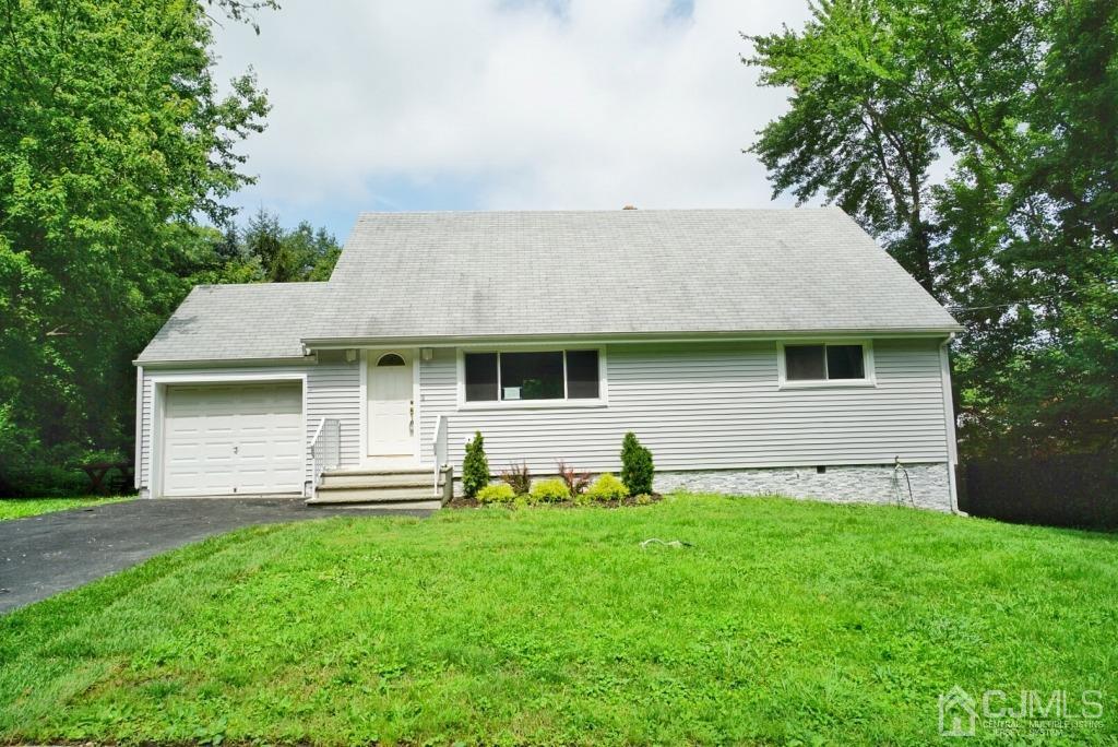 50 Dock Road Matawan, NJ 07747 - Photo 1 of 37 a front view of house with yard and green space