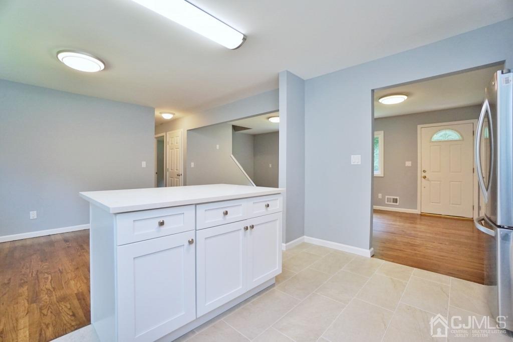 50 Dock Road Matawan, NJ 07747 - Photo 12 of 37 a spacious bathroom with a granite countertop sink mirror and cabinets