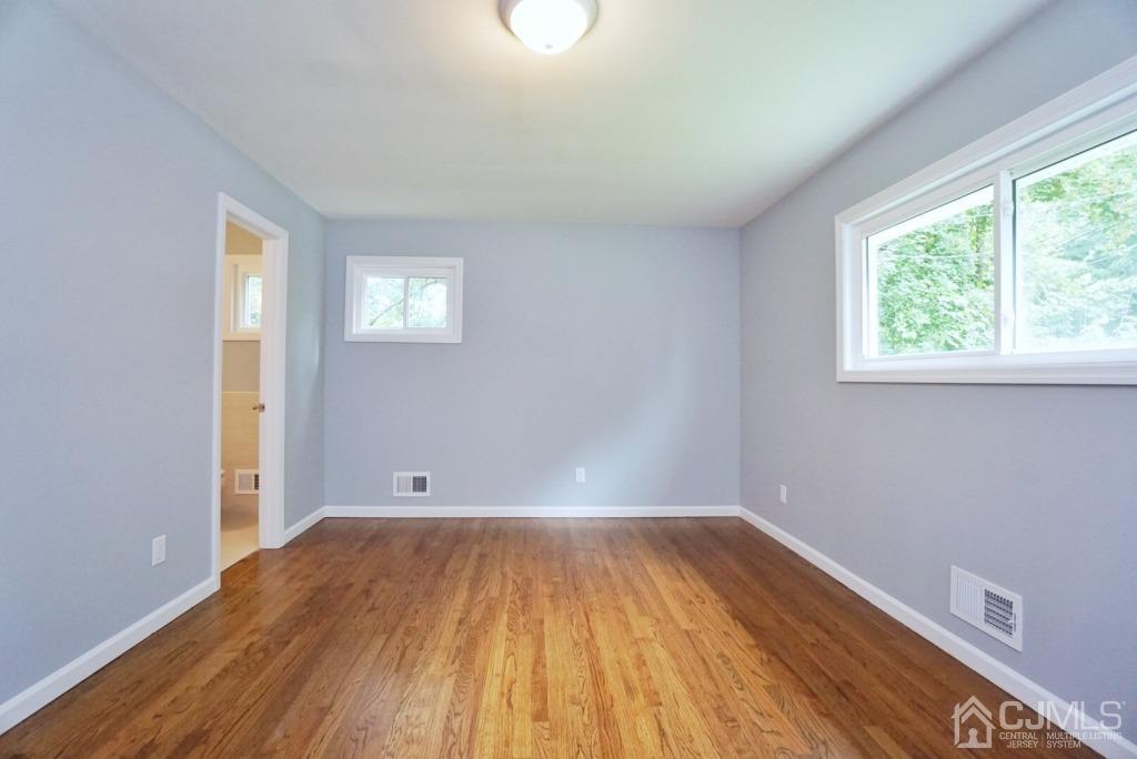 50 Dock Road Matawan, NJ 07747 - Photo 14 of 37 a view of a room with wooden floor and white walls