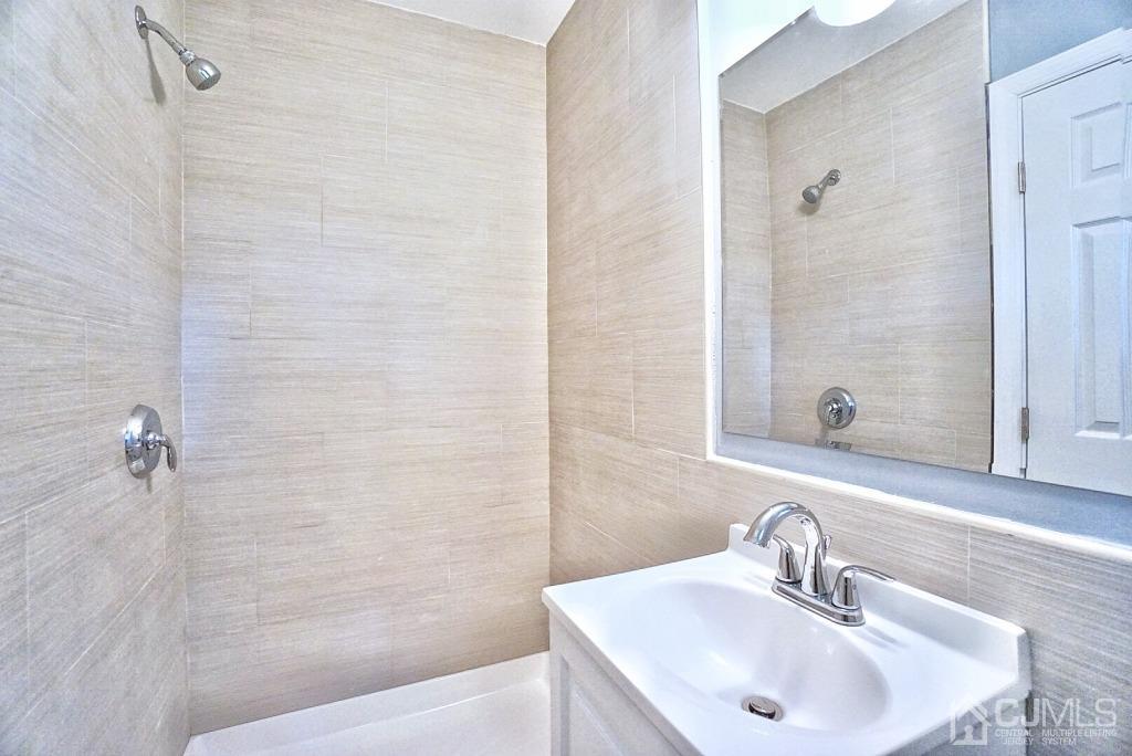 50 Dock Road Matawan, NJ 07747 - Photo 17 of 37 a bathroom with a sink a shower