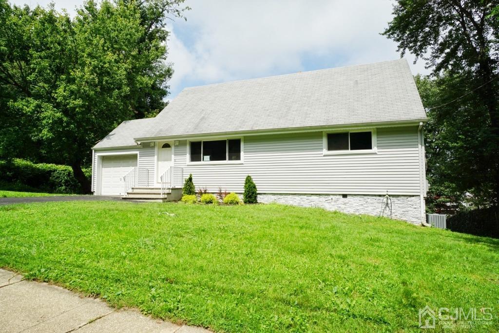 50 Dock Road Matawan, NJ 07747 - Photo 3 of 37 a front view of house with yard and green space