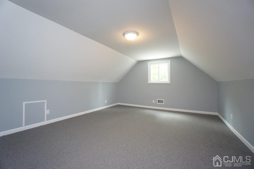 50 Dock Road Matawan, NJ 07747 - Photo 30 of 37 an empty room with a empty space and windows