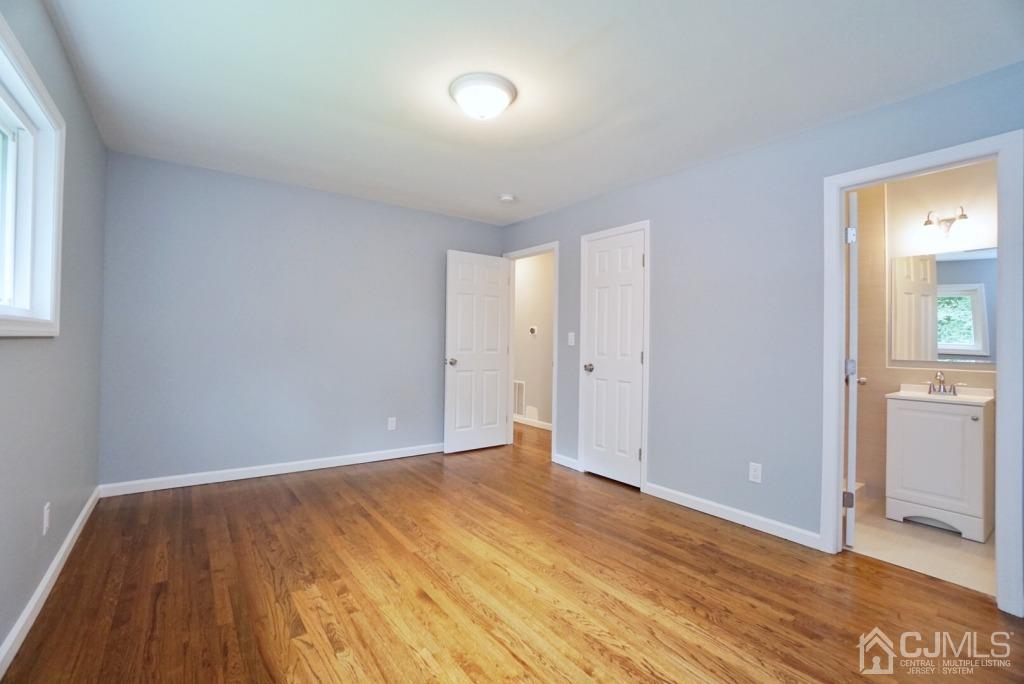 50 Dock Road Matawan, NJ 07747 - Photo 37 of 37 an empty room with wooden floor and windows
