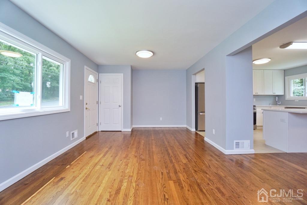 50 Dock Road Matawan, NJ 07747 - Photo 7 of 37 a view of an empty room with wooden floor and a window