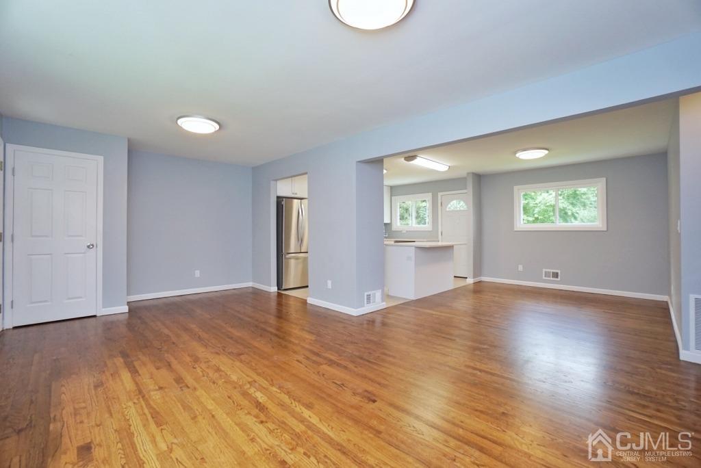 50 Dock Road Matawan, NJ 07747 - Photo 8 of 37 an empty room with wooden floor and windows
