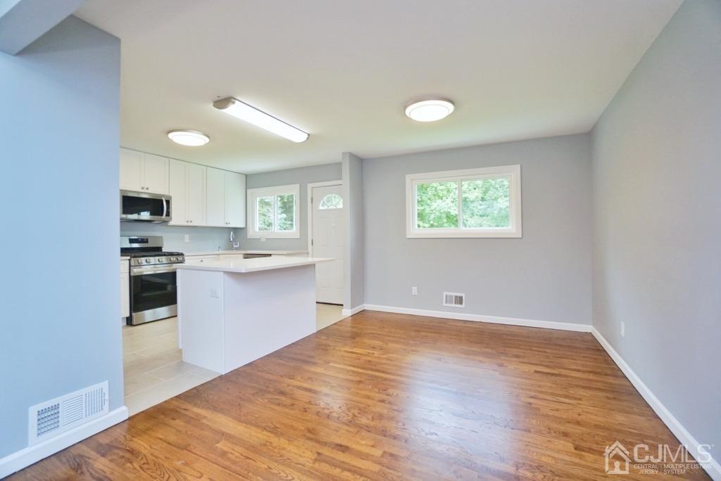 50 Dock Road Matawan, NJ 07747 - Photo 9 of 37 a view of kitchen with sink and wooden floor